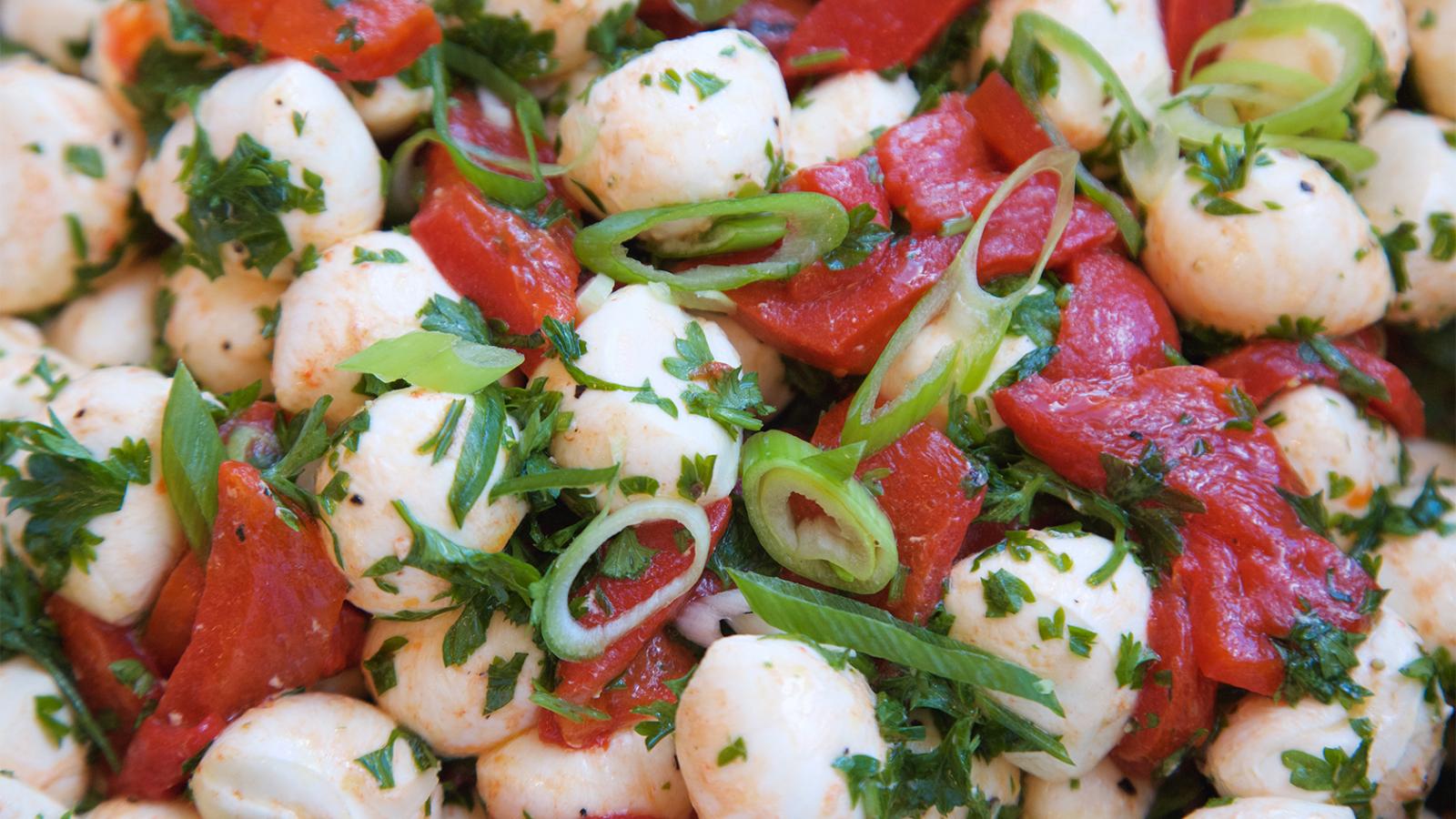 Pear, tomato, and bocconcini mozzarella salad with pesto emulsion