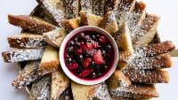 French toast with powdered sugar and berries.