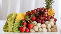 An array of fruit: kiwi, strawberries, grapes, etc.