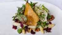Confit of white asparagus, maple poached pear, dried cranberries, crumbled gorgonzola, and mixed baby greens in cilantro lime vinaigrette