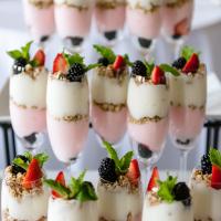 Strawberry and vanilla yogurt parfaits with berries.